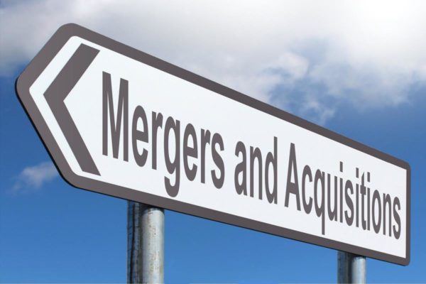 A sign that reads "Mergers and Acquisitions".
