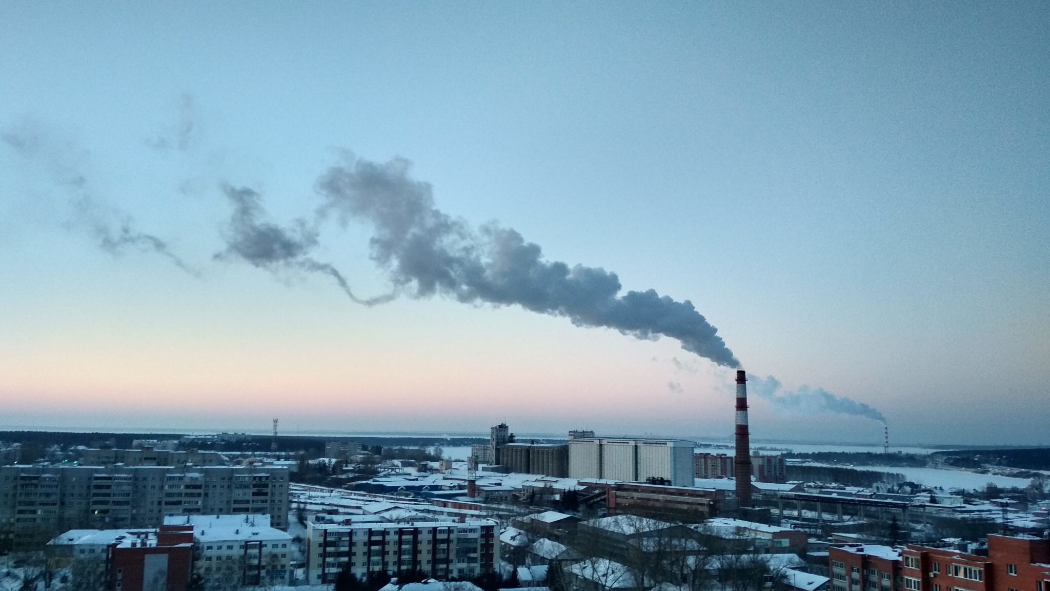 City Skyline Under Blue Sky and White Clouds