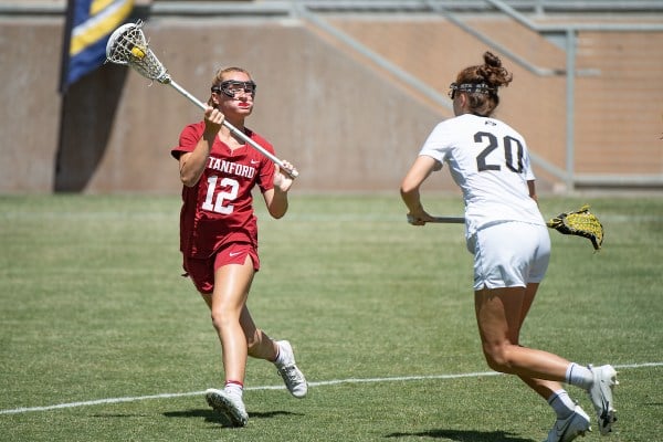 Sophomore midfield Ailish Kelly makes a move on a UC Davis defender.