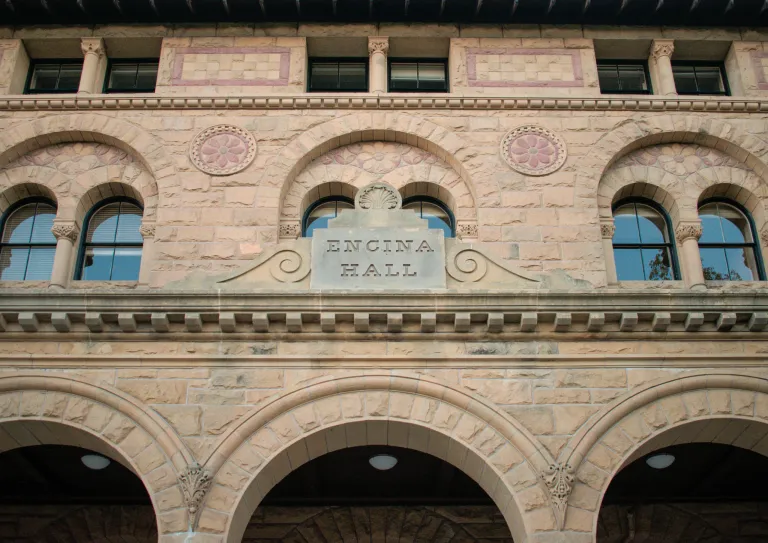 close up shot of front of encina hall and archways