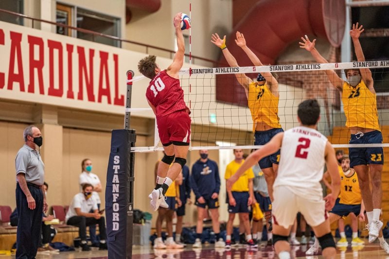 Junior outside hitter Kevin Lamp hits at the net.