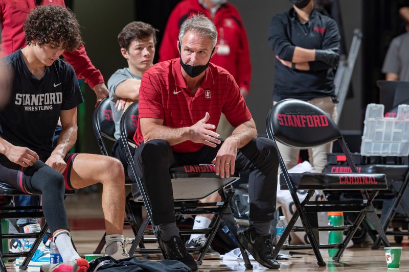 Stanford wrestling head coach Rob Koll gives advice from the sidelines.