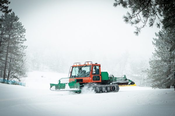 a snow plow on ski slopes