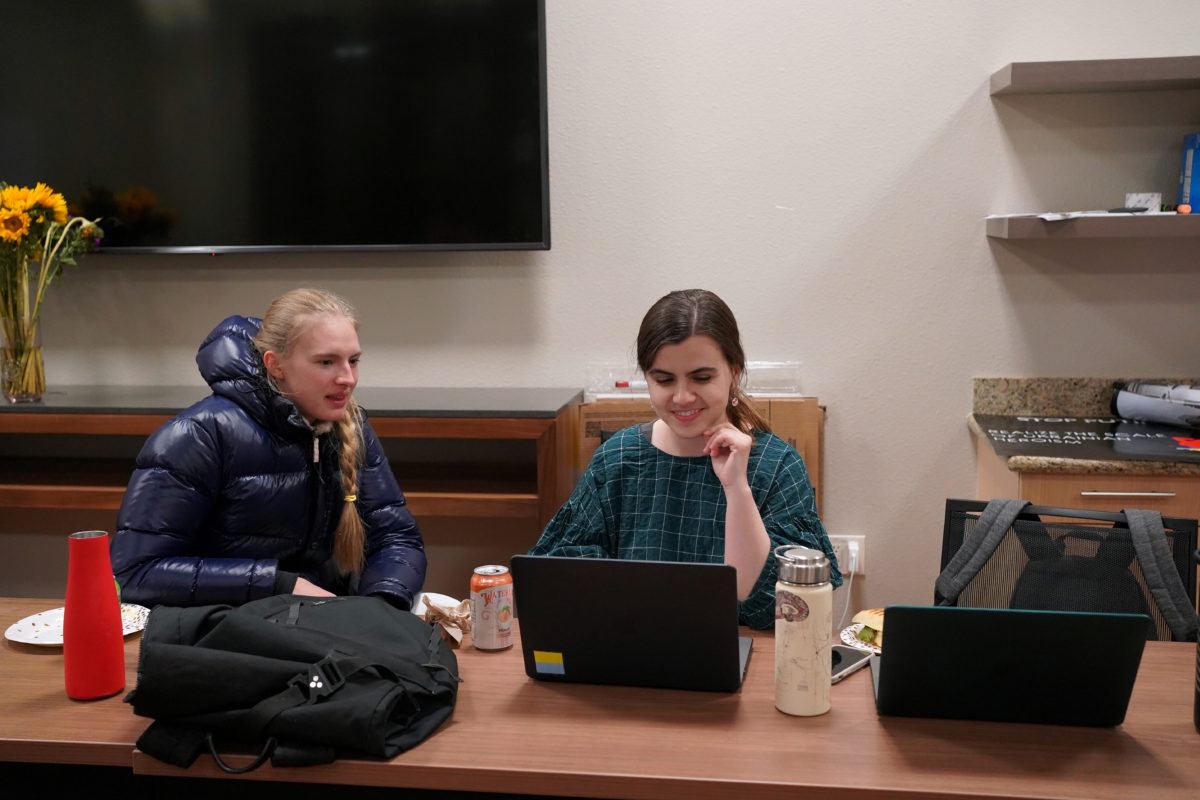 Solomiia Savchuk works with another student on the telehealth platform.