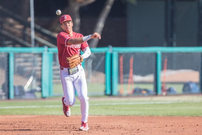 Sophomore third baseman Drew Bowser throws to first base.