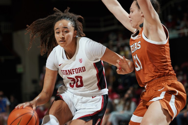 Junior guard Haley Jones dribbles past a Texas defender.