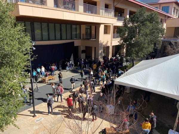 A group of business school students gathering at the GSB campus for a protest