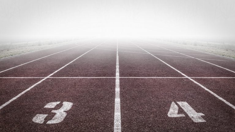 The start of a race track covered in fog