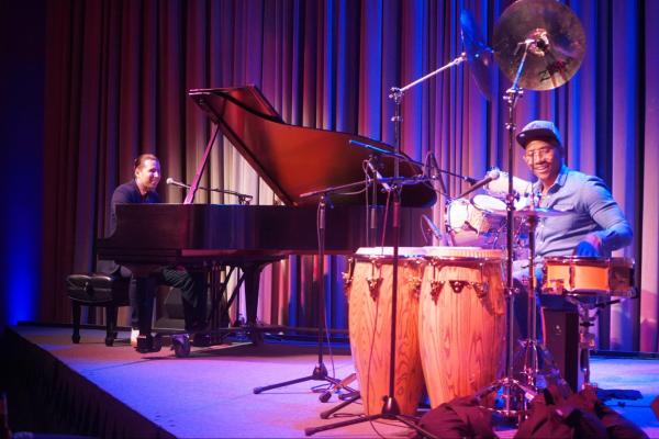 Alfredo Rodriguez sits behind the piano while Pedrito Martinez plays his drumset, including tumbas and conventional pieces