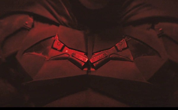 Chest of Batman suit with Batman symbol, colored with red light. From first suit test for "The Batman."