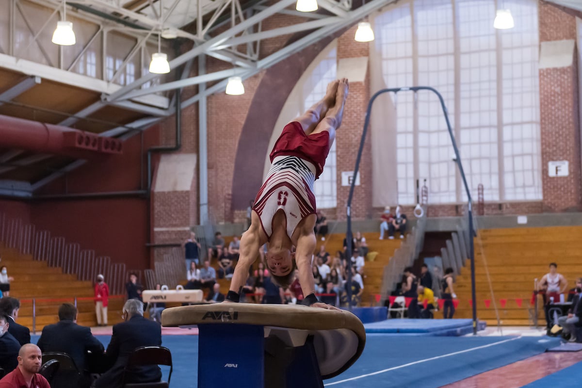 Senior Curran Phillips competes on the vault.