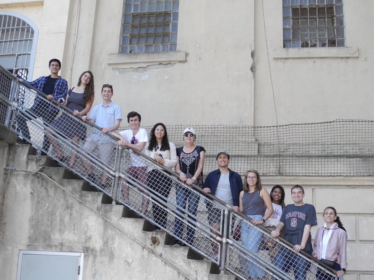 Students pose on a staircase at Alcatraz.