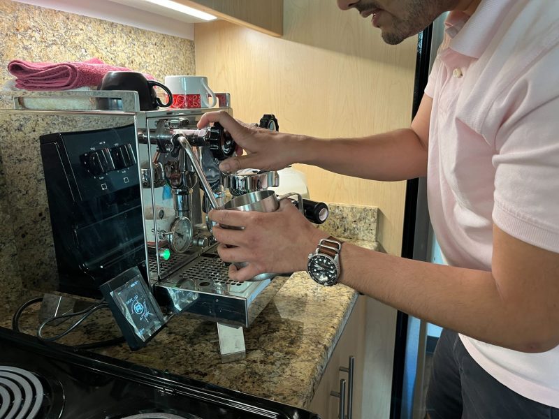 A barista makes a latte in EVGR
