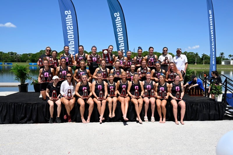 The women's rowing team poses with their second place trophies at the 2022 NCAA Championship.