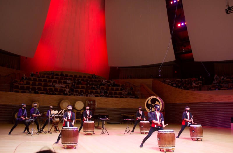 Members of Stanford Taiko playing their instruments while performing a song