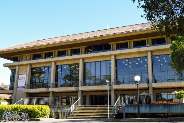 Picture of Earth Systems Building, sign on building says "Stanford Earth; School of Earth, Energy, & Environmental Sciences"
