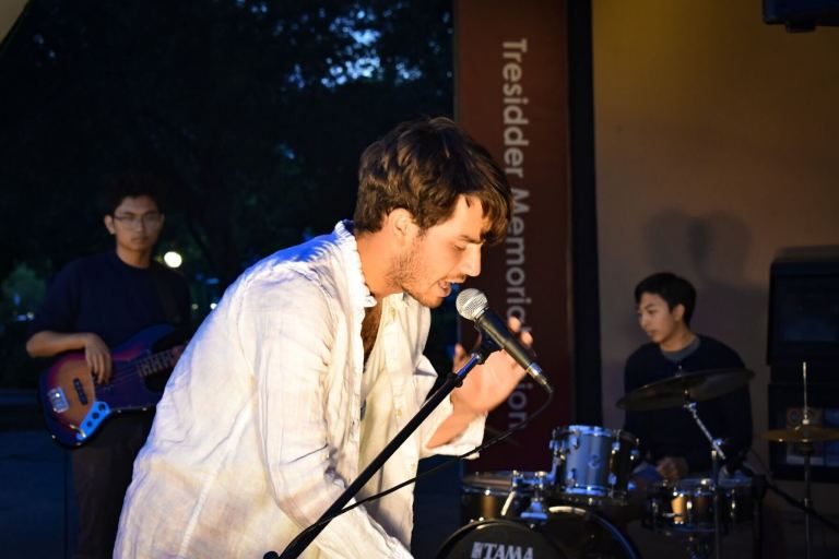 Danny Ritz performs at the arbor, singing into the microphone