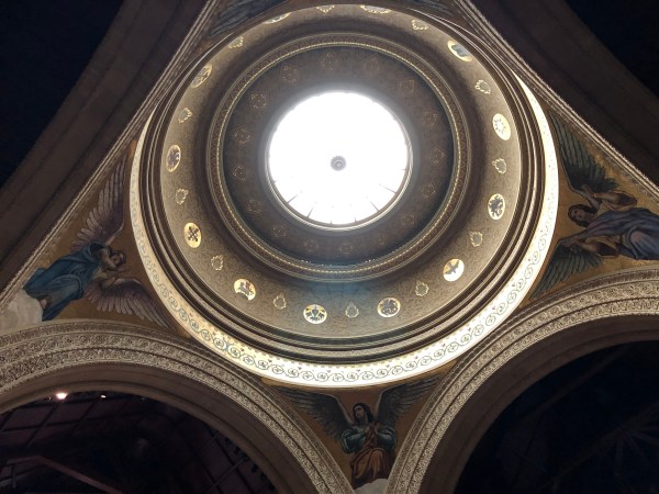 Upward-facing photo of the dome in Memorial Church, with daylight coming in through the glass