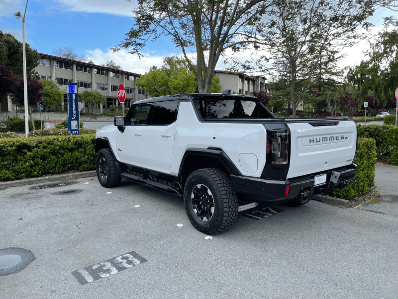 photo of new Hummer EV pickup truck in white, in the parking lot by Florence Moore Hall