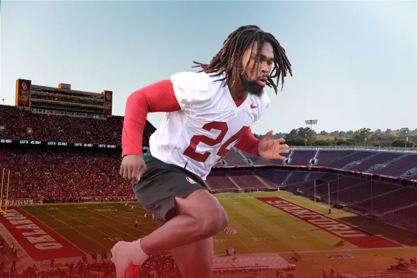 Fifth-year safety Patrick Fields does a drill in front of a backdrop of Stanford and Oklahoma's stadiums