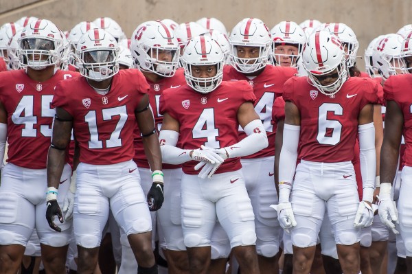 Stanford football players stand next to each other