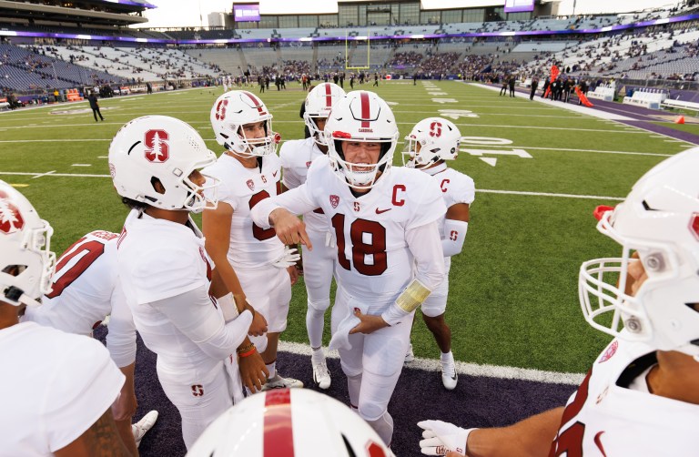 Football players huddle up together