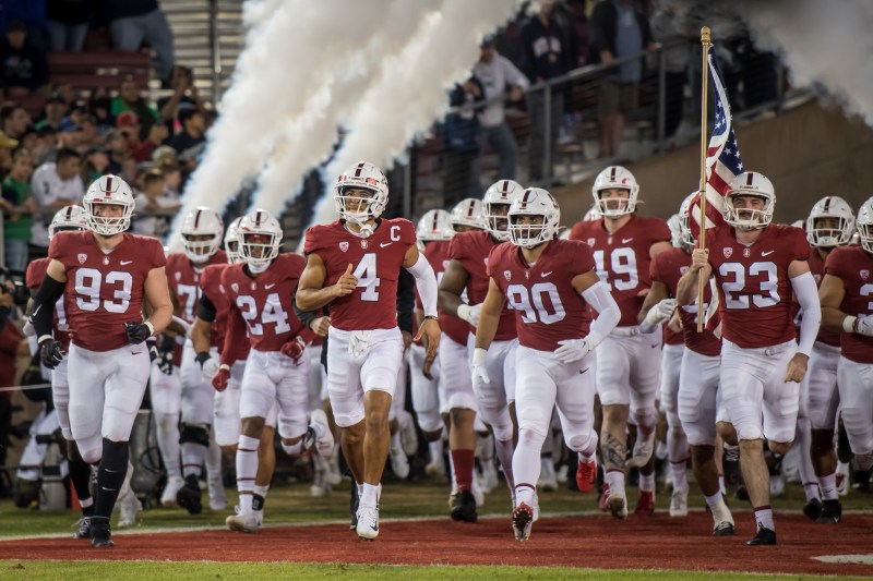 Stanford football team runs out onto the field