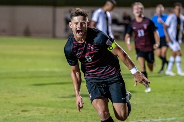 A soccer player celebrates his goal