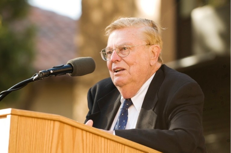 Lokey speaks at a podium