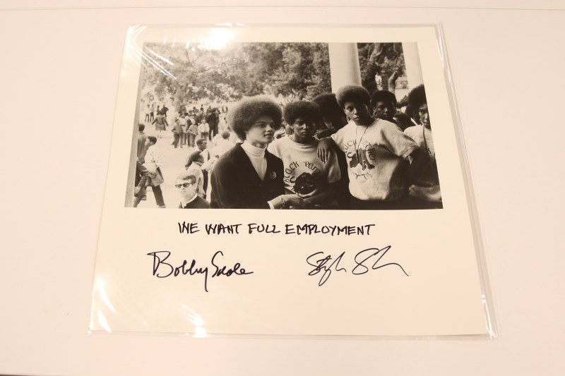 Square print of photo of Black Panther women, with text "We Want Full Employment" and signed by Bobby Seale and Stephen Shames