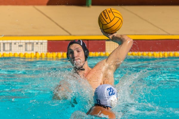 A player about to throw a water polo ball.