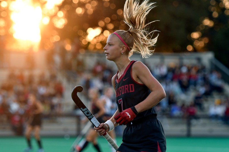 A field hockey player looks for the ball