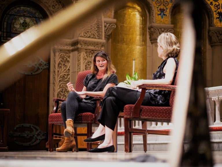 Lulu Miller sits on the left, behind Prof. Caroline Winterer on the right.