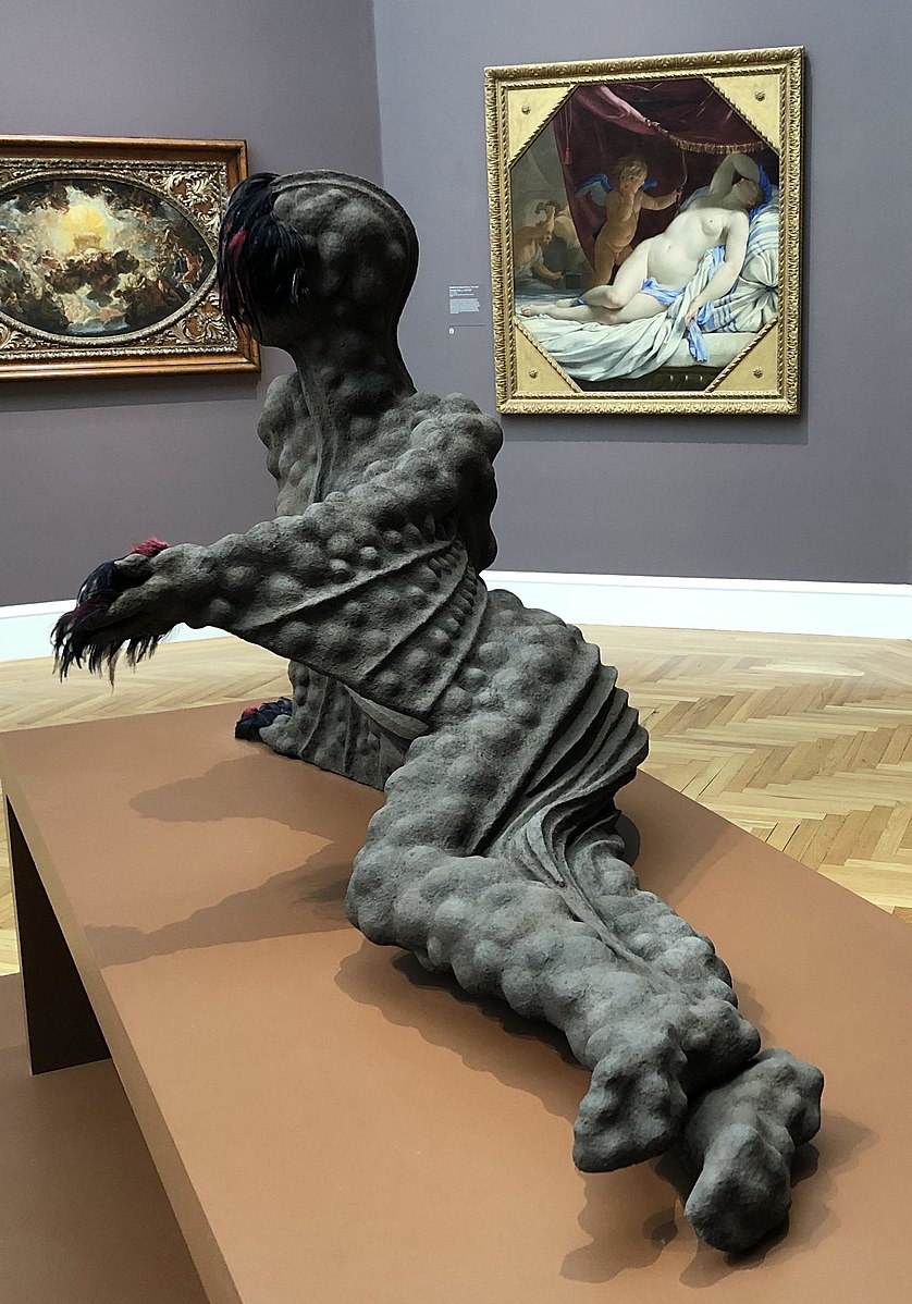 Wangechi Mutu's sculpture of a posthuman figure laying down in the Legion of Honor Museum in San Francisco