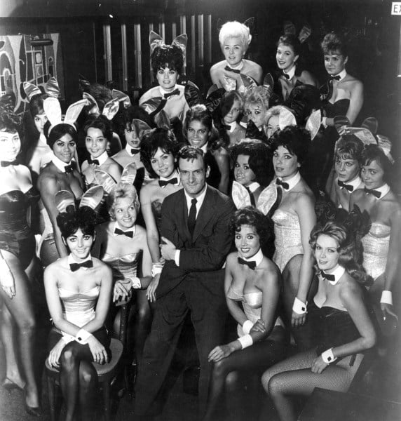 Hugh Hefner surrounded by Playboy bunnies.