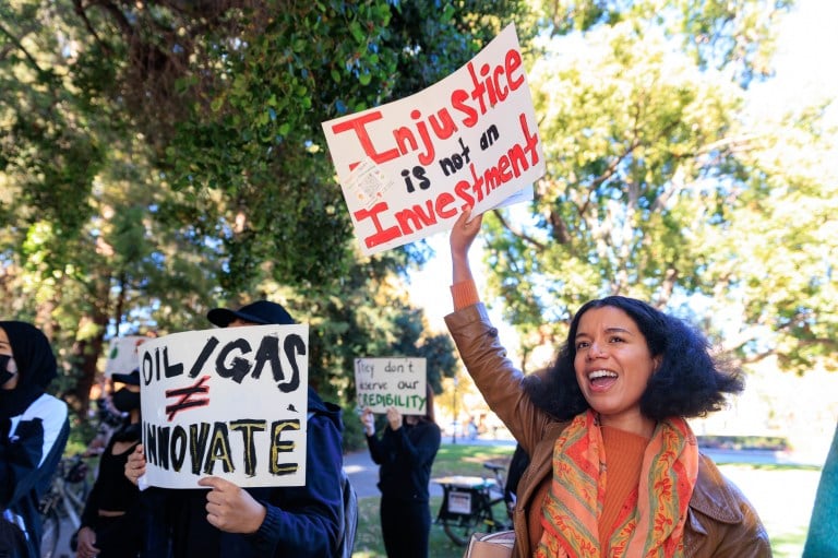 [STANFORD, CA] — November 3, 2022: Demonstrators organized by the Coalition for a True School of Sustainability protest fossil fuel funding of Stanford’s Doerr School of Sustainability outside the Global Energy Forum at Stanford University on November 3, 2022. (Photo: NIKOLAS LIEPINS/The Stanford Daily)