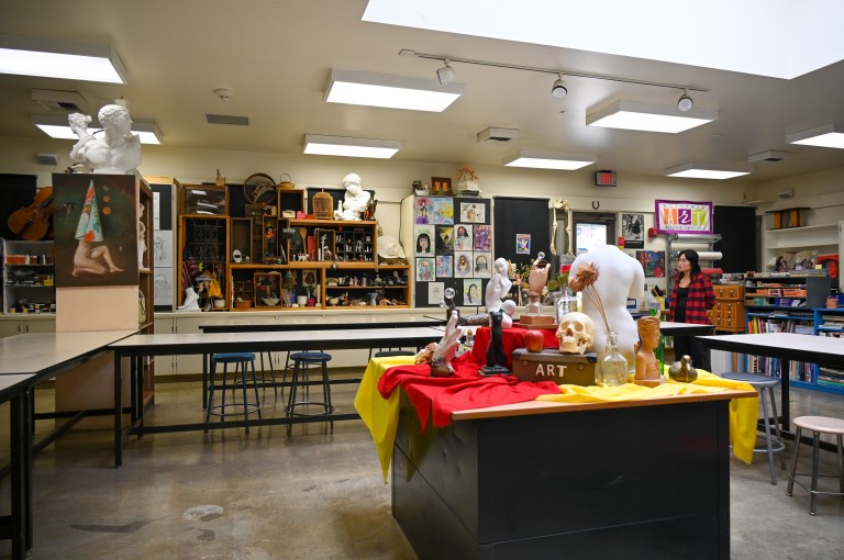 An arts classroom with items on a table.