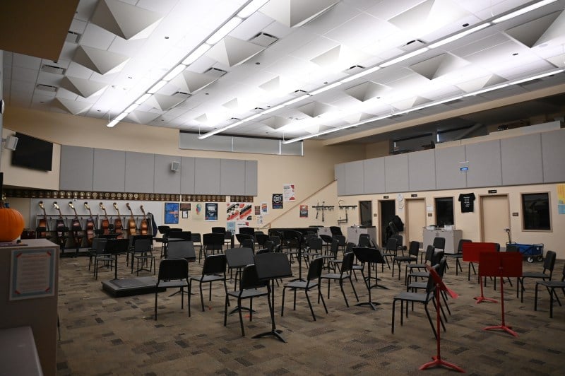 A music room with empty chairs. 