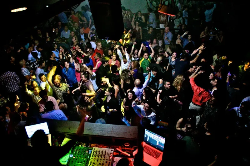 Students partying in front of a DJ
