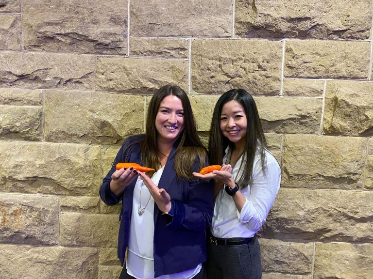 Kacey Chandler Gauer and Katherine Chiou hold peppers