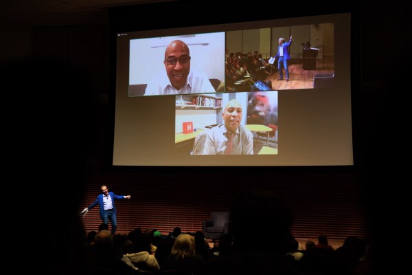 Cory Booker and Deval Patrick in Professor Jim Steyer’s class on Monday night on a zoom call projected on a screen.