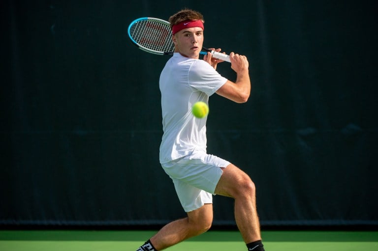 Arthur Fery winds up to hit a backhand during a tennis match.