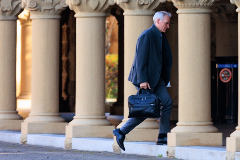 Tessier-Lavigne walking in Stanford's main quad