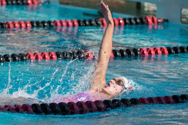 Claire Curzon swims the backstroke.