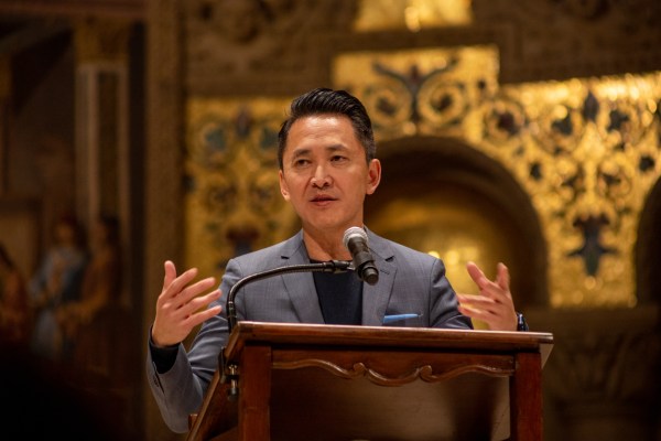 Writer Viet Thanh Nguyen delivers a lecture in front of the microphone