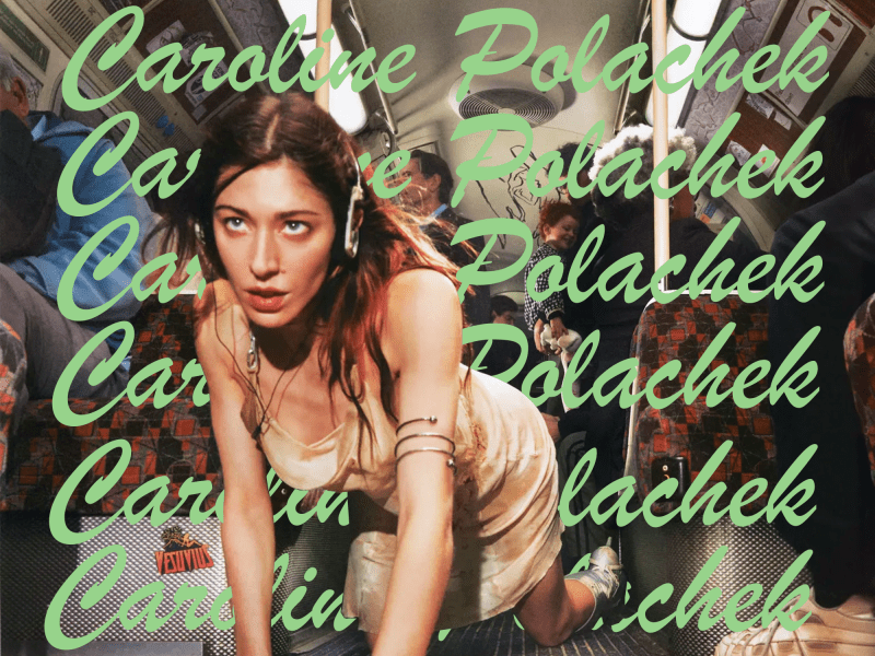 Caroline Polachek is seen crawling on her latest album cover (with her name written numerous times behind her in green).