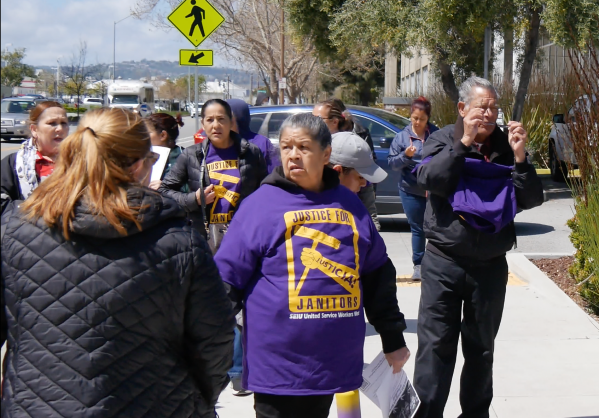 USWW members distributed shirts to janitorial staff which read, “Justicia! Justice for Janitors” at the Stanford Redwood City campus on Wednesday.