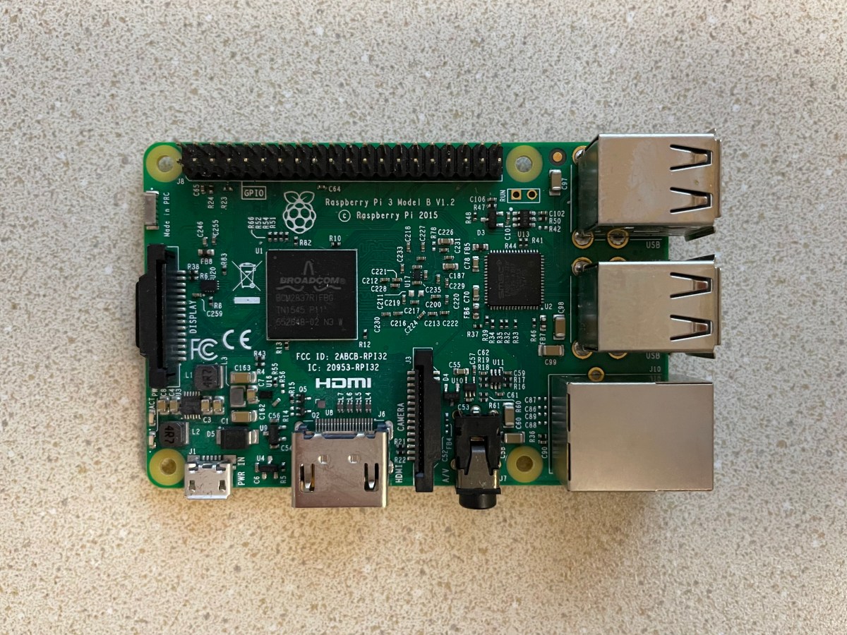 A Raspberry Pi, a green credit-card sized computer with various ports.
