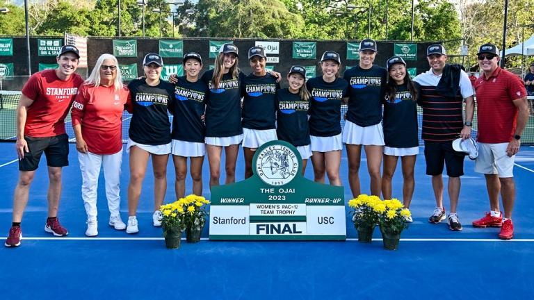 Players and coaches lose in champions' shirts on a tennis court after winning the Pac-12 title.