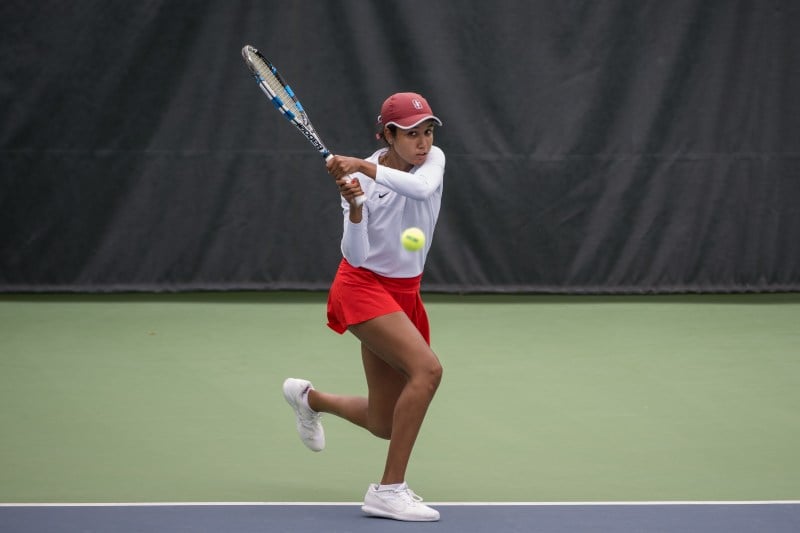 Angelica Blake striking the ball during the match against Oklahoma State.